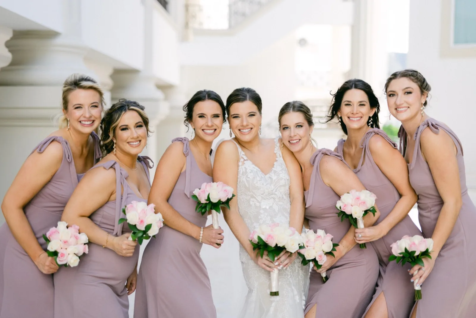 Bridesmaids with bouquets on a wedding morning in the Riviera Maya